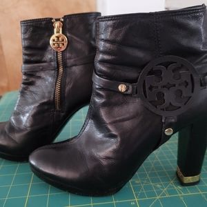 Tory Burch leather logo ankle boots with gold hardware.